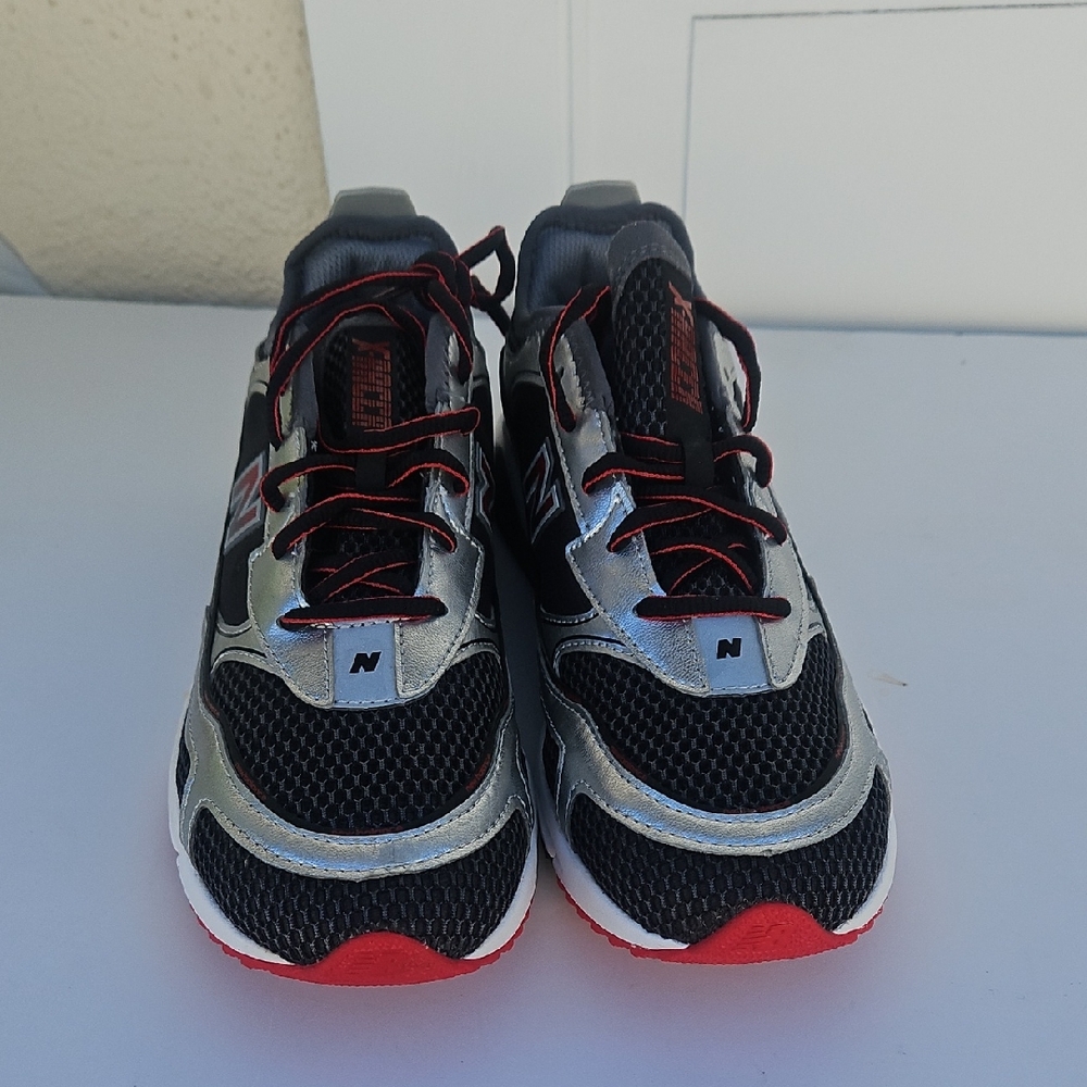 New Balance Black and Silver Sneakers with Red Accents